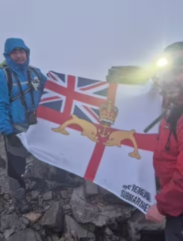 Two of the Three Peaks Team members looking quite tired in the gloom - with the ubiquitous WRS ensign