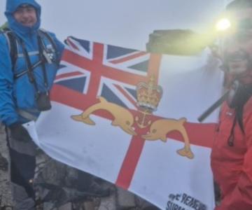Two of the Three Peaks Team members looking quite tired in the gloom - with the ubiquitous WRS ensign